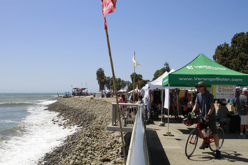 Vendor tents along the boardwalk with ocean views