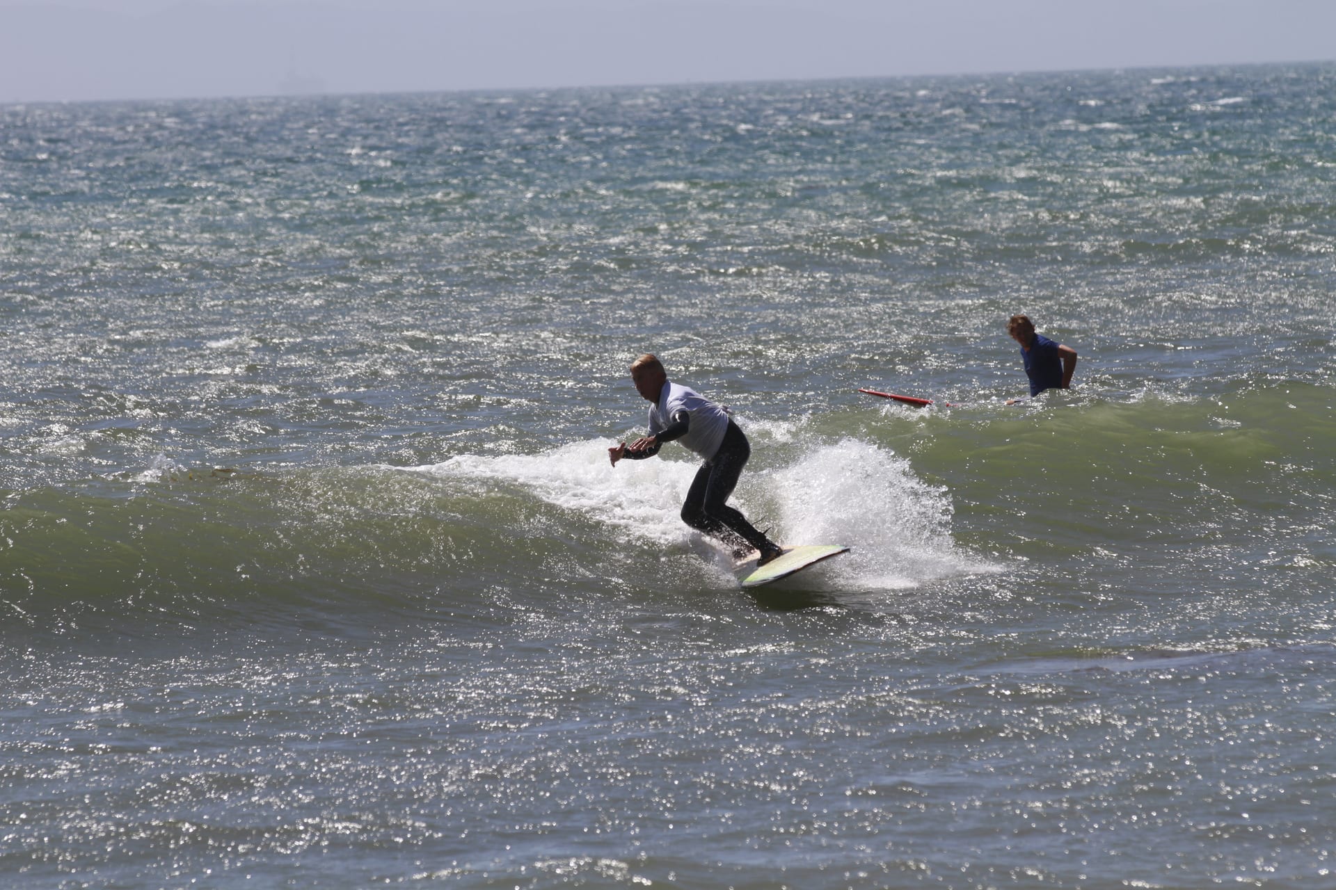 Surfer riding a wave at the C Street Classic Surf Contest